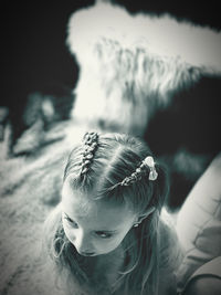 High angle view of girl sitting at home