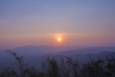 Scenic view of silhouette mountains against sky during sunset