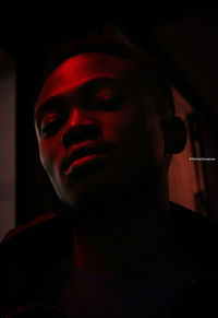 Close-up portrait of young man looking away