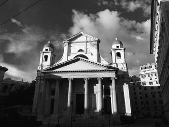 Low angle view of church against cloudy sky