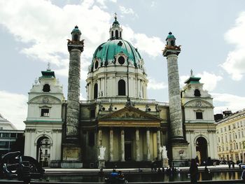 Low angle view of church against cloudy sky