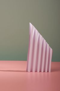 High angle view of pink umbrella on table against wall