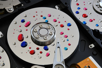 High angle view of colorful drops on hard drives