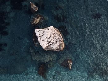 High angle view of rock formation in sea