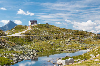View of stream along countryside landscape