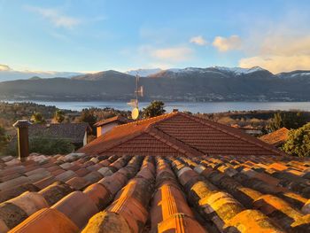 Scenic view of houses and buildings against sky