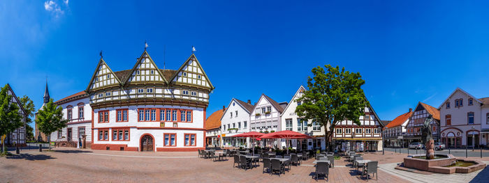 View of buildings against blue sky