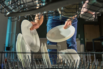 Low angle view of man standing in factory