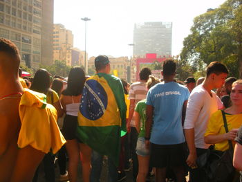 People standing on street in city