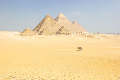 Panoramic view of the great pyramids of giza, from the sahara desert 