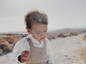 Portrait of a kid walking in the desert