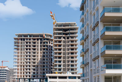 The process of construction of residential buildings against the blue sky in alanya, turkey.