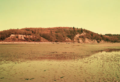 Scenic view of land against clear sky