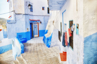 Clothes drying on clothesline against buildings