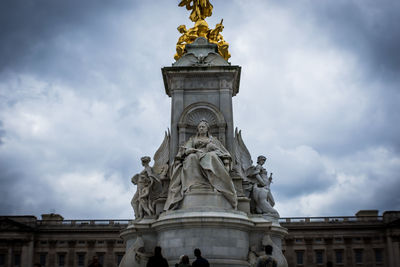 Low angle view of monument against cloudy sky