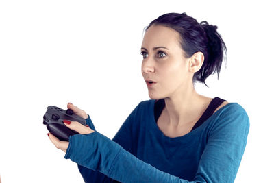 Portrait of young woman photographing camera