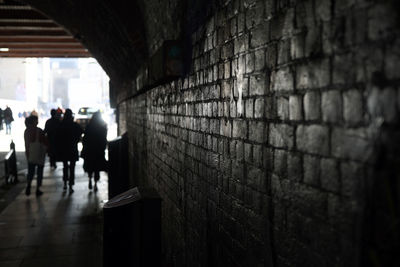 Man walking in corridor of building