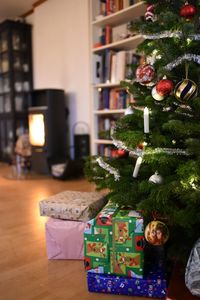 Close-up of illuminated christmas tree at home