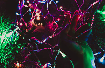 Close-up of illuminated christmas tree at night