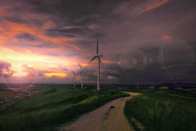 Scenic view of field against sky during sunset