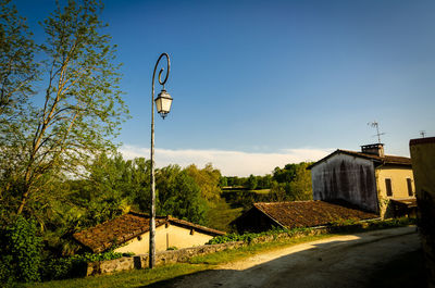 Street and buildings against sky