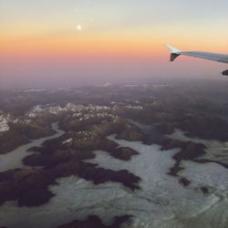 Aerial view of landscape against sky during sunset