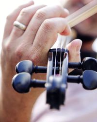 Close-up of hands playing piano