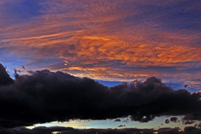 Low angle view of dramatic sky during sunset