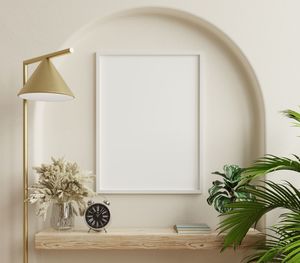 Poster mockup with vertical white frame in home interior background.3d rendering
