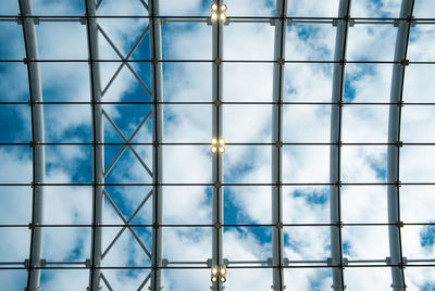 Full frame shot of glass window against blue sky