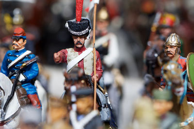 Close-up of figurines against blurred background