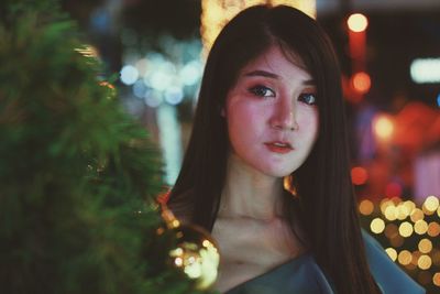 Portrait of beautiful woman at night