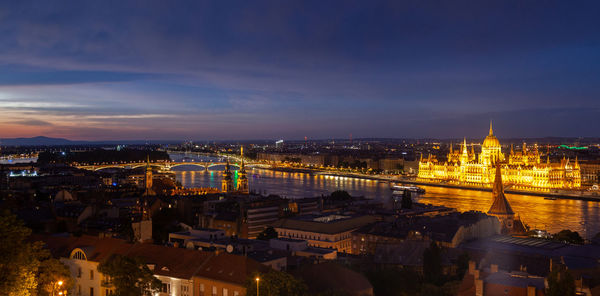 High angle view of illuminated buildings in city at night