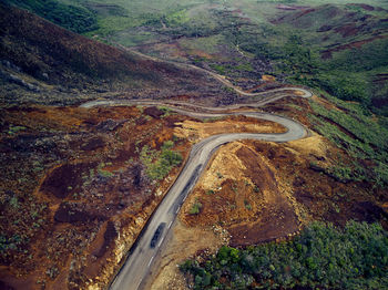 High angle view of winding road on land