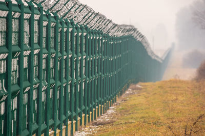 Metal fence on field