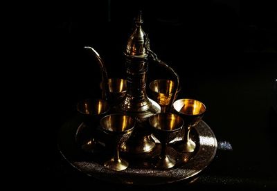 Close-up of fire on table against black background