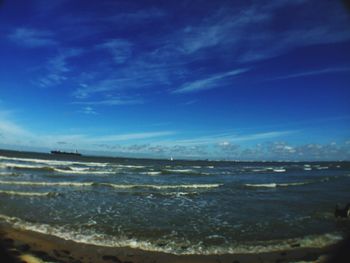 Scenic view of sea against cloudy sky