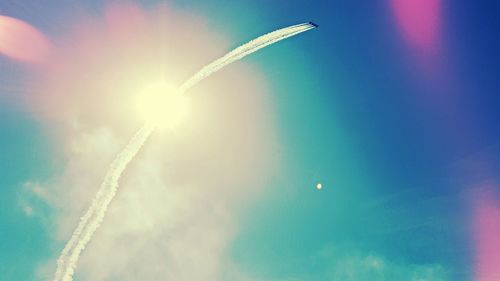 Low angle view of vapor trails in sky