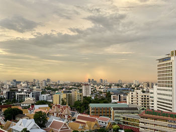 High angle view of buildings against sky during sunset