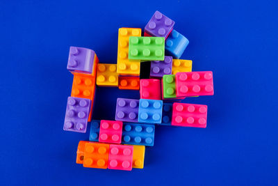 Close-up of toy blocks on blue background