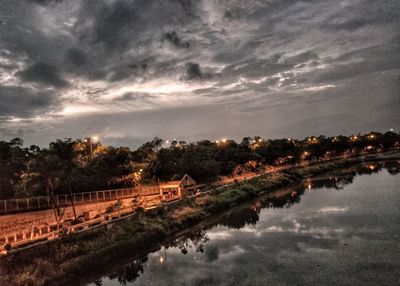 Scenic view of river against sky at dusk