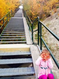 High angle view of woman on footbridge