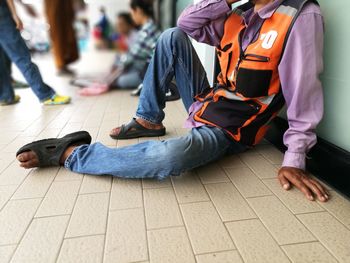 Low section of people sitting outdoors