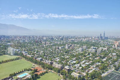 High angle view of modern buildings in city against sky