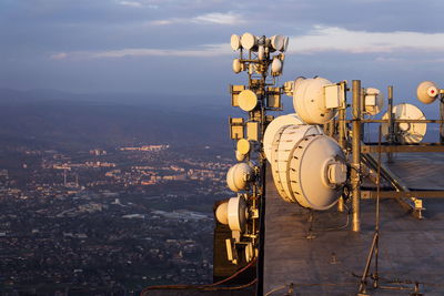 Aerial view of buildings and mountains against sky