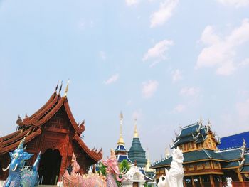 Low angle view of colorful temple buildings against sky