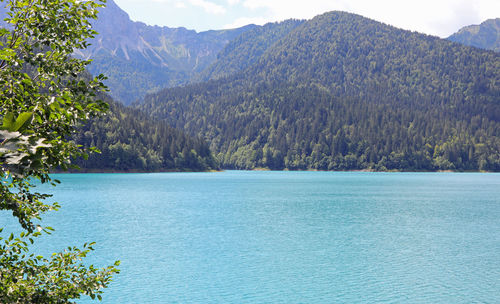 Scenic view of lake and mountains against sky