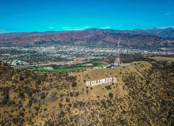 High angle view of landscape against blue sky