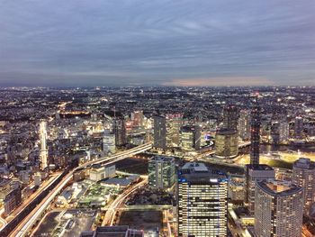 Cityscape against cloudy sky