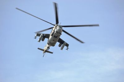 Low angle view of airplane flying against clear sky